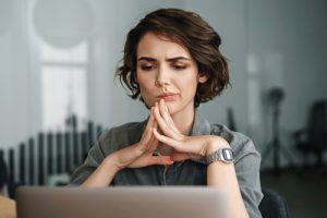 woman contemplating her SEO strategy and digital marketing